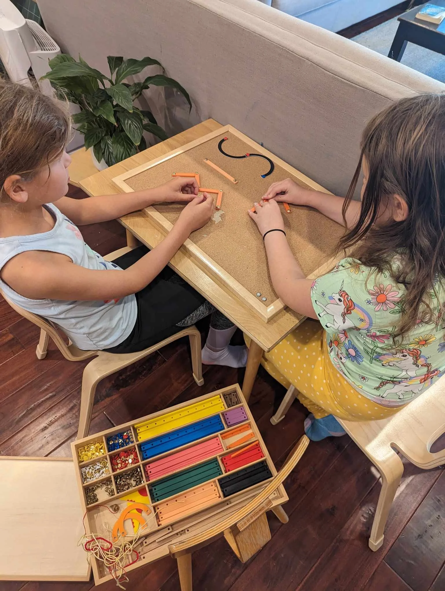 Guide and child sharing a moment in the classroom